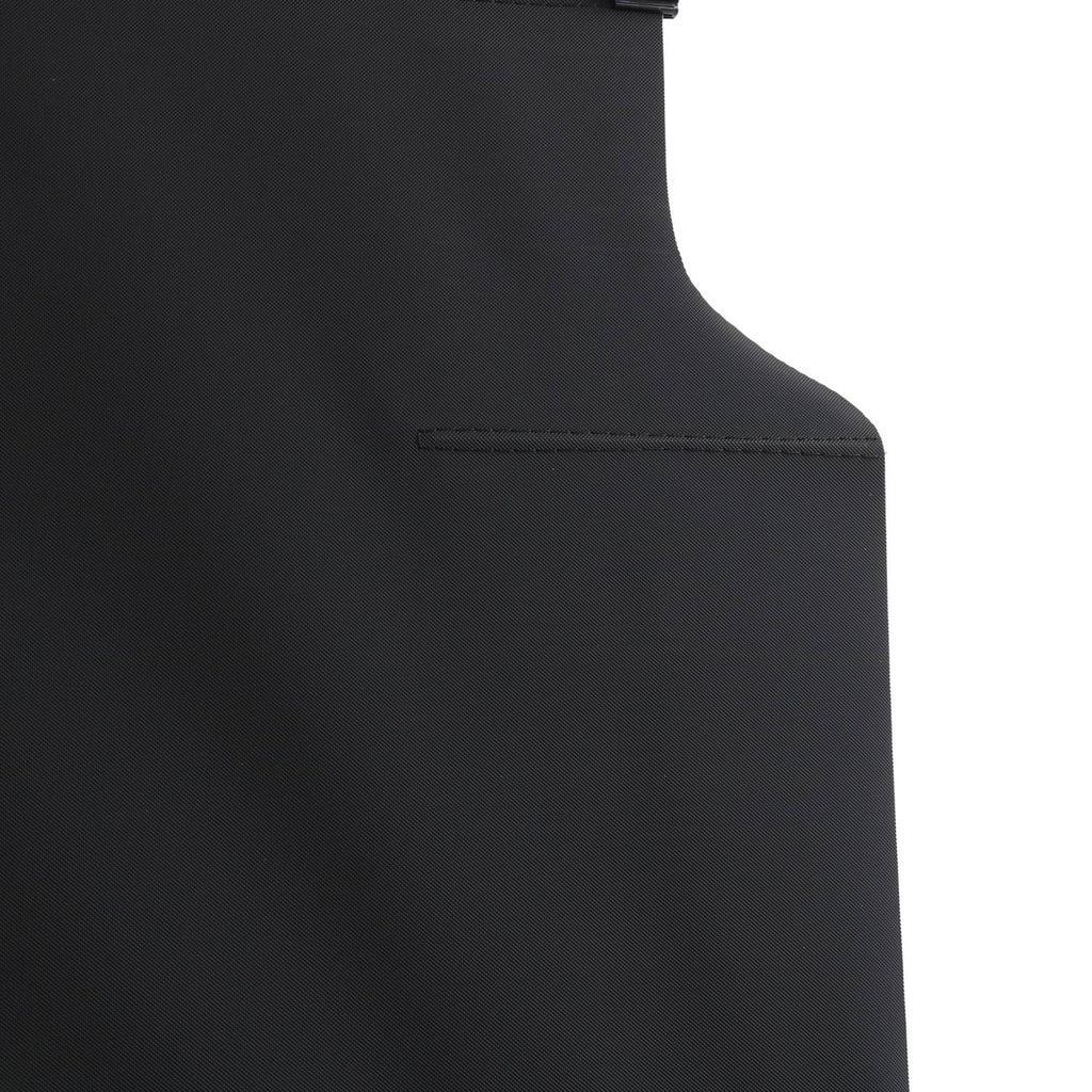 Black curved side panel of cargo cover with stitched trim and attachment point.