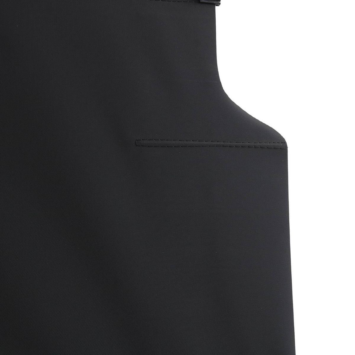 Black curved side panel of cargo cover with stitched trim and attachment point.