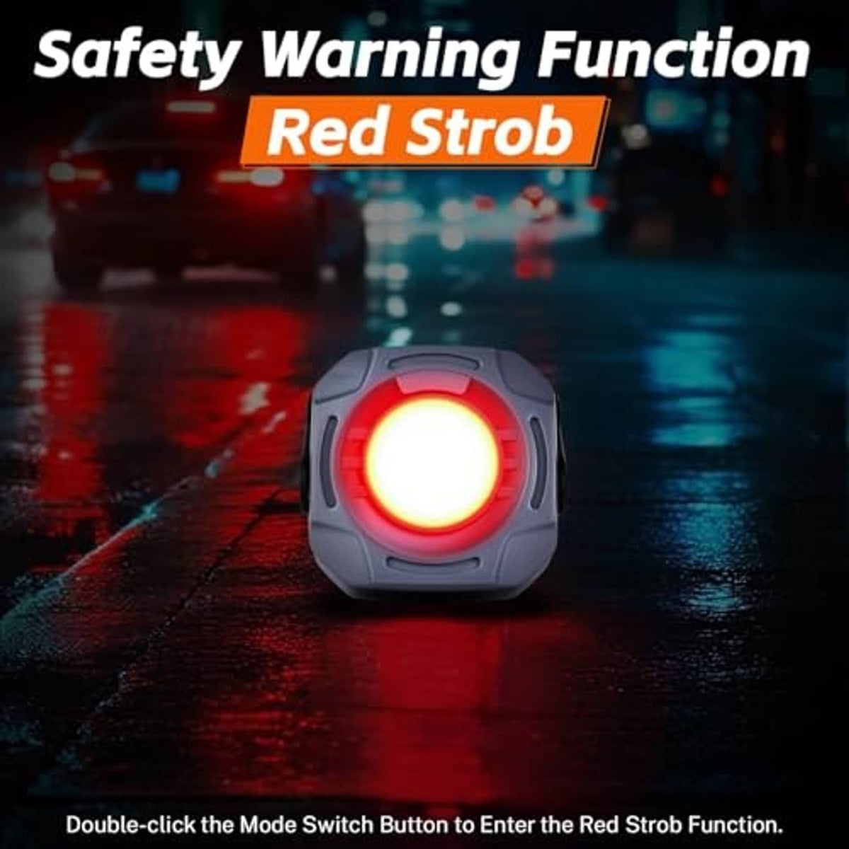 Gray work light emitting a red strobe glow from the front circular lens