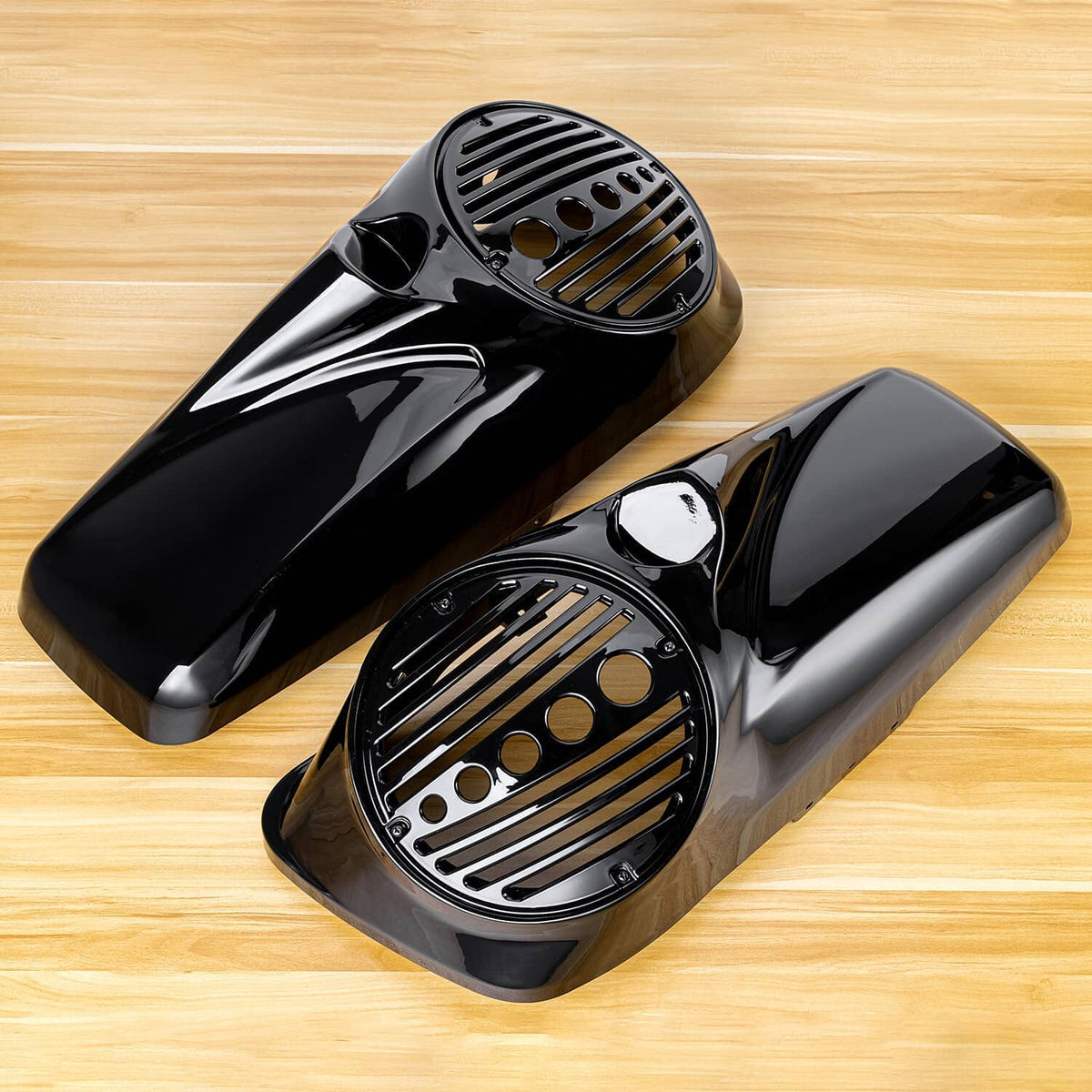 Black saddlebag speaker lids with vented metal grilles and mounting hardware