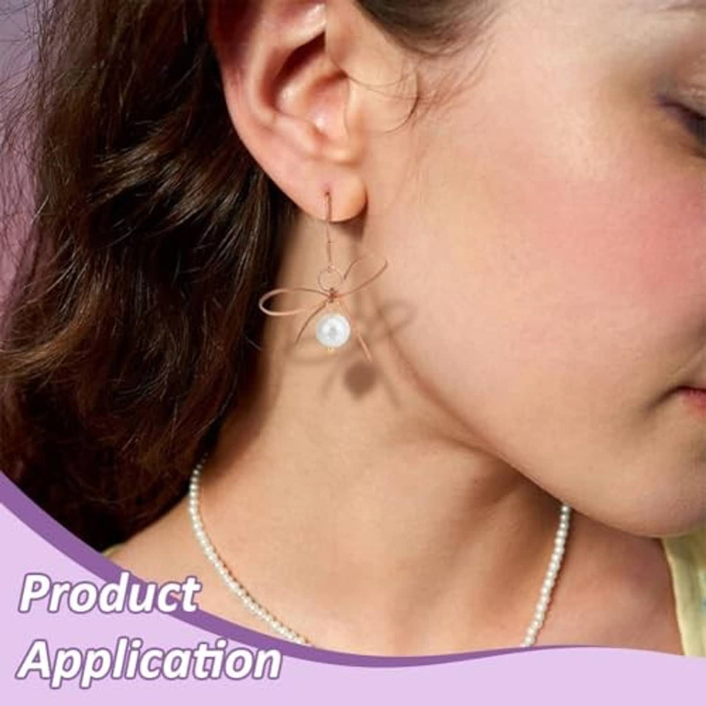 Copper wire hoop earrings with pearl drops on model