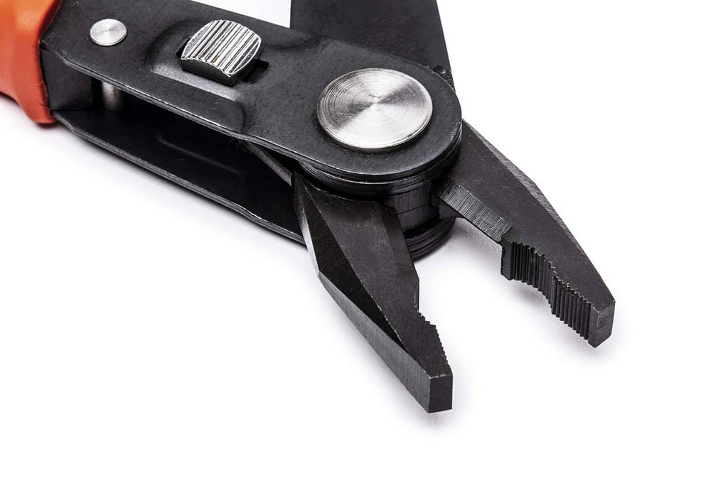 Close-up of wire stripping notches and cutting jaws on black pliers with orange grip.