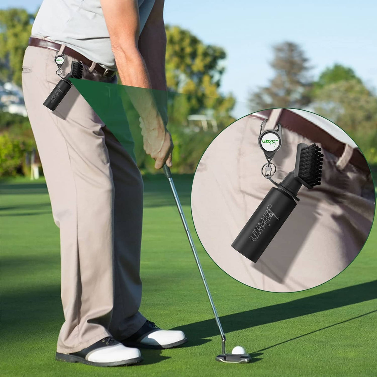 Black golf club cleaning brush clipped to golf bag while brushing a club