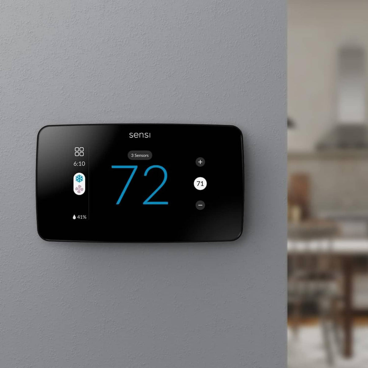 Black touchscreen smart thermostat mounted on wall with large 72° display