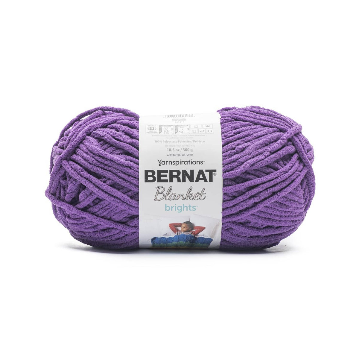 Purple super bulky yarn skein, thick twisted strands with label on front