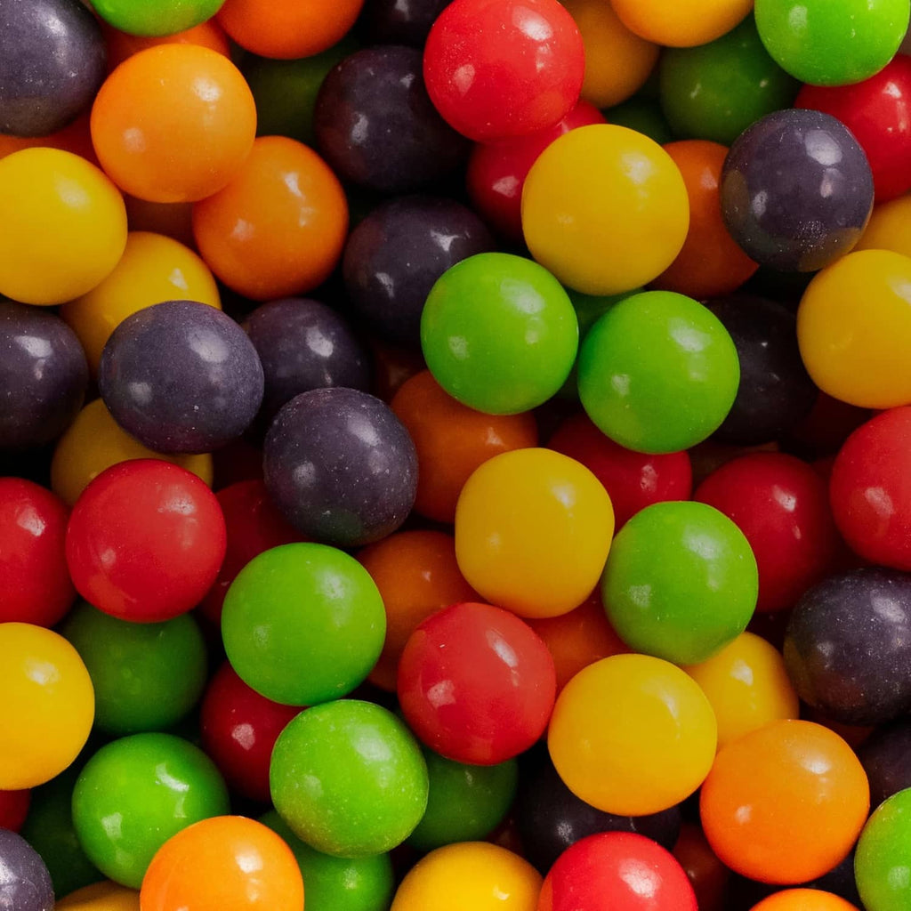Assorted jawbreaker candies in red, green, yellow, orange, and purple