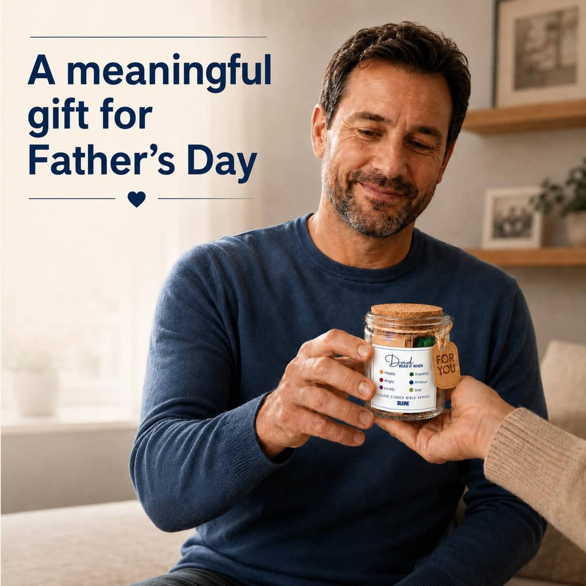 Father’s Day Bible verse jar gift set in glass held by a man in a navy long-sleeve shirt.