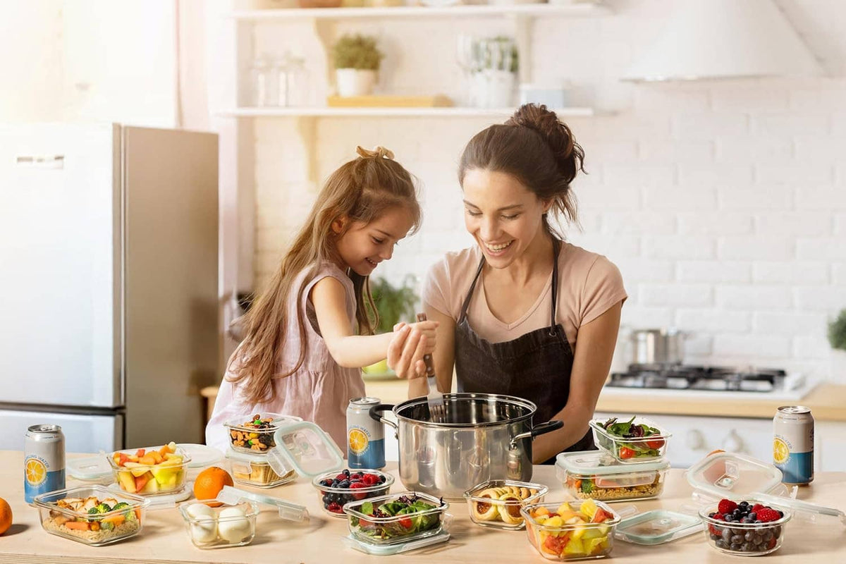 Airtight glass food storage containers with locking lids on a kitchen table