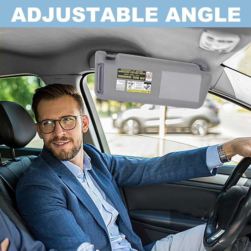 Gray visor vanity mirror flipped down above driver seat