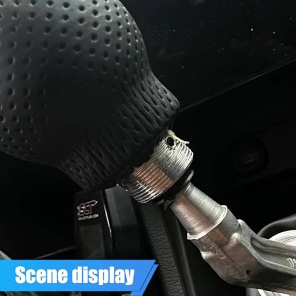 Close-up of black perforated leather shift knob base with metal threaded connector