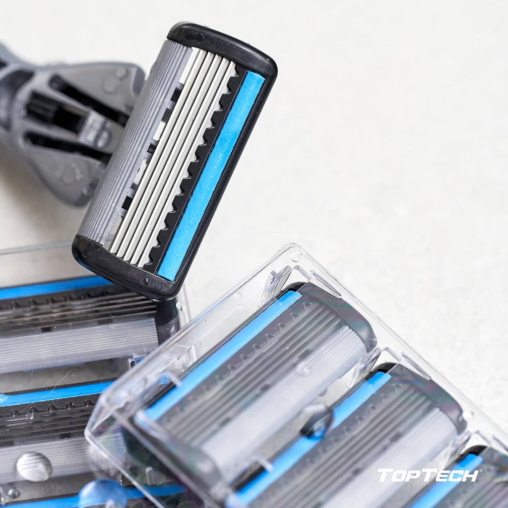 Razor refill cartridges in clear plastic tray, blade cassettes visible