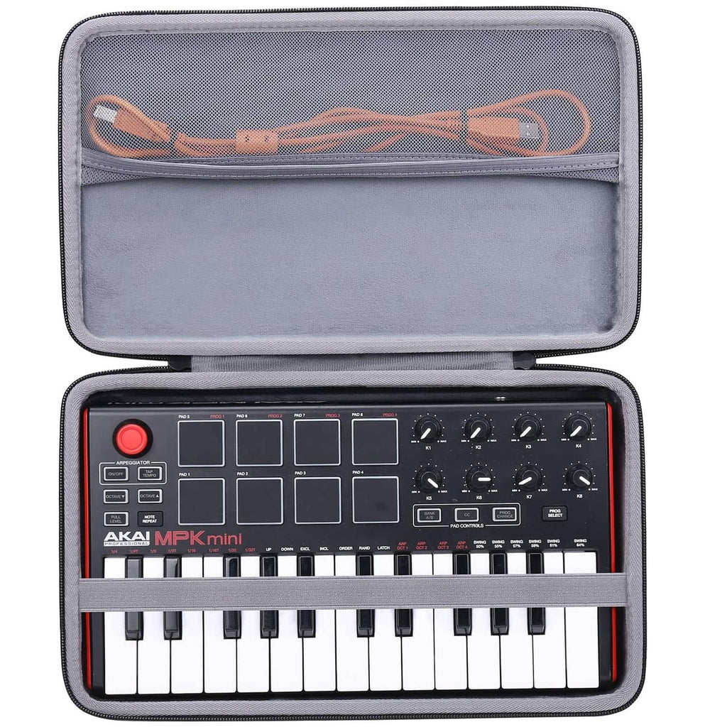 Open hard keyboard case with gray lining and orange cable compartment
