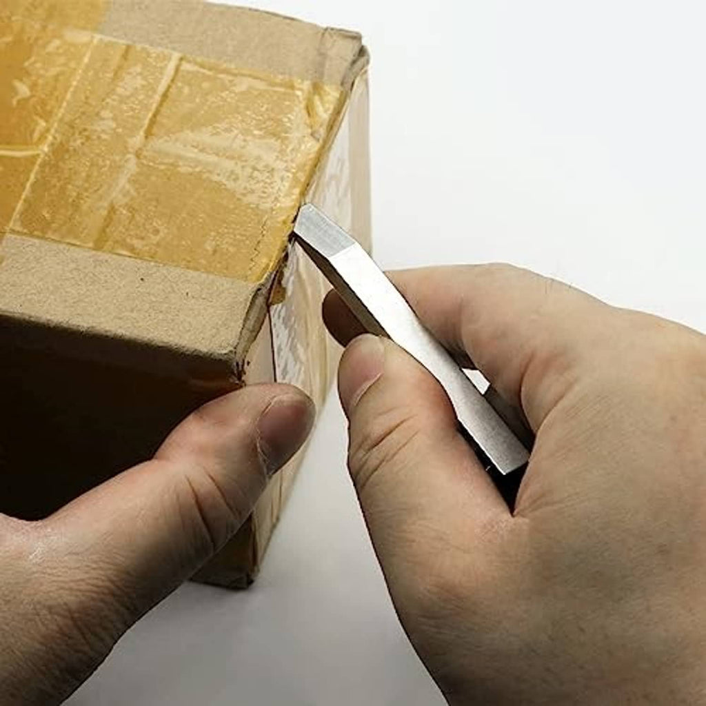 Mini metal prybar in hand prying open a cardboard box flap