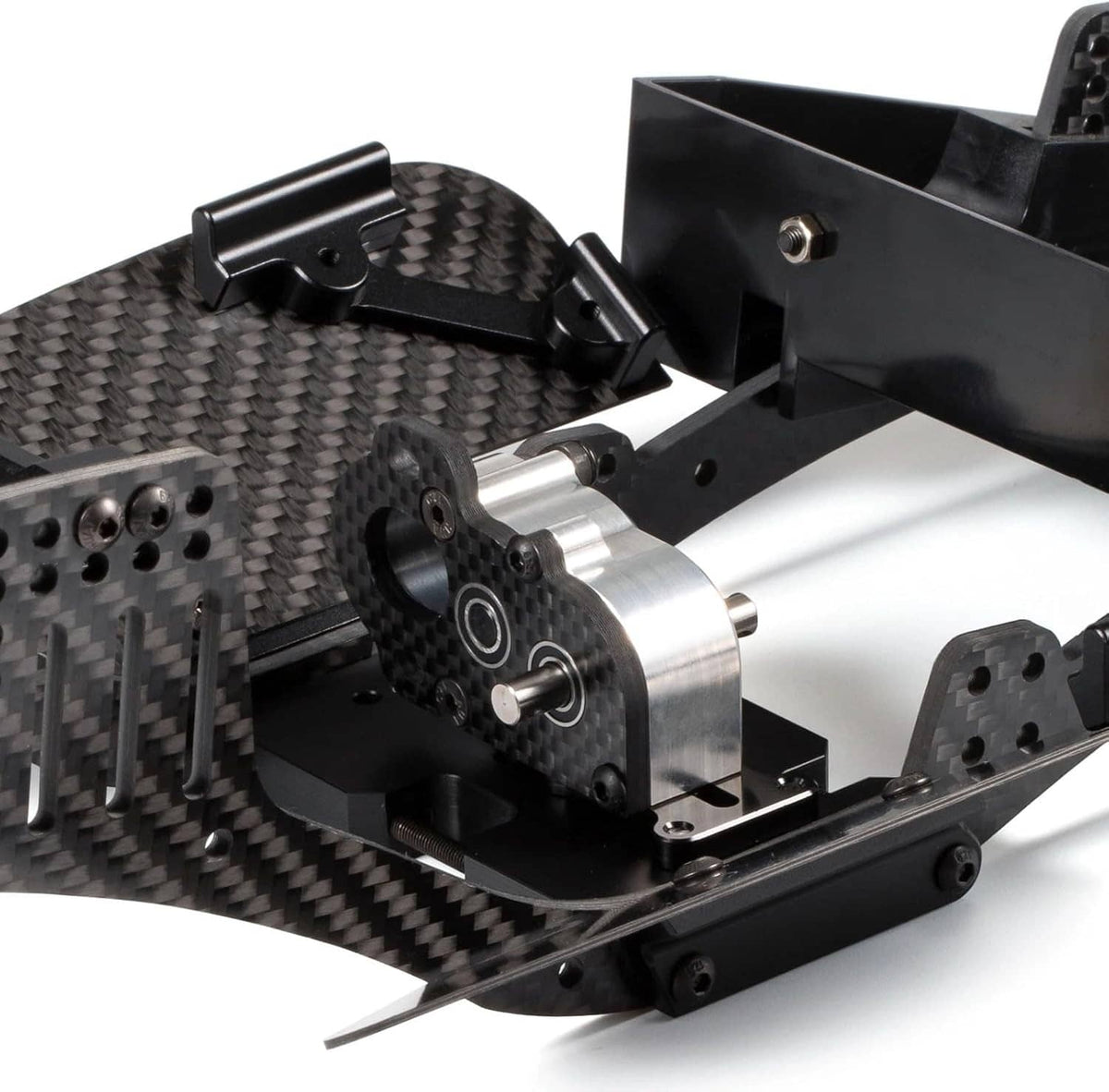 RC portal transmission assembly with carbon-fiber plates, metal shafts, and black brackets