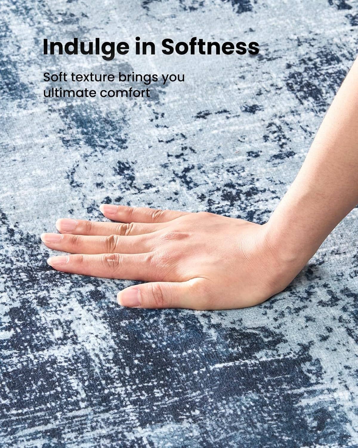 Blue abstract area rug texture with soft surface shown by hands