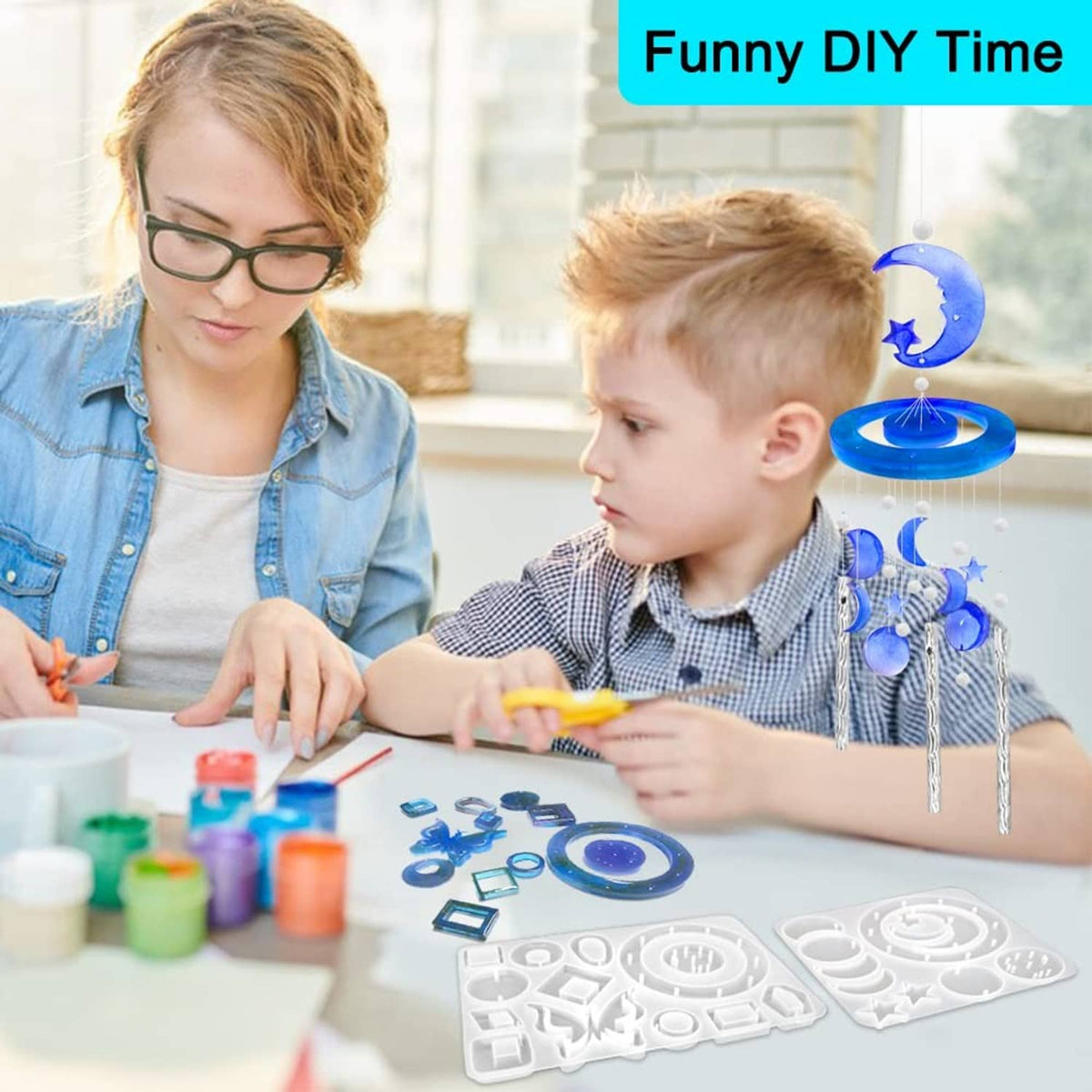 DIY wind chime resin mold on a table with blue charm pieces during crafting