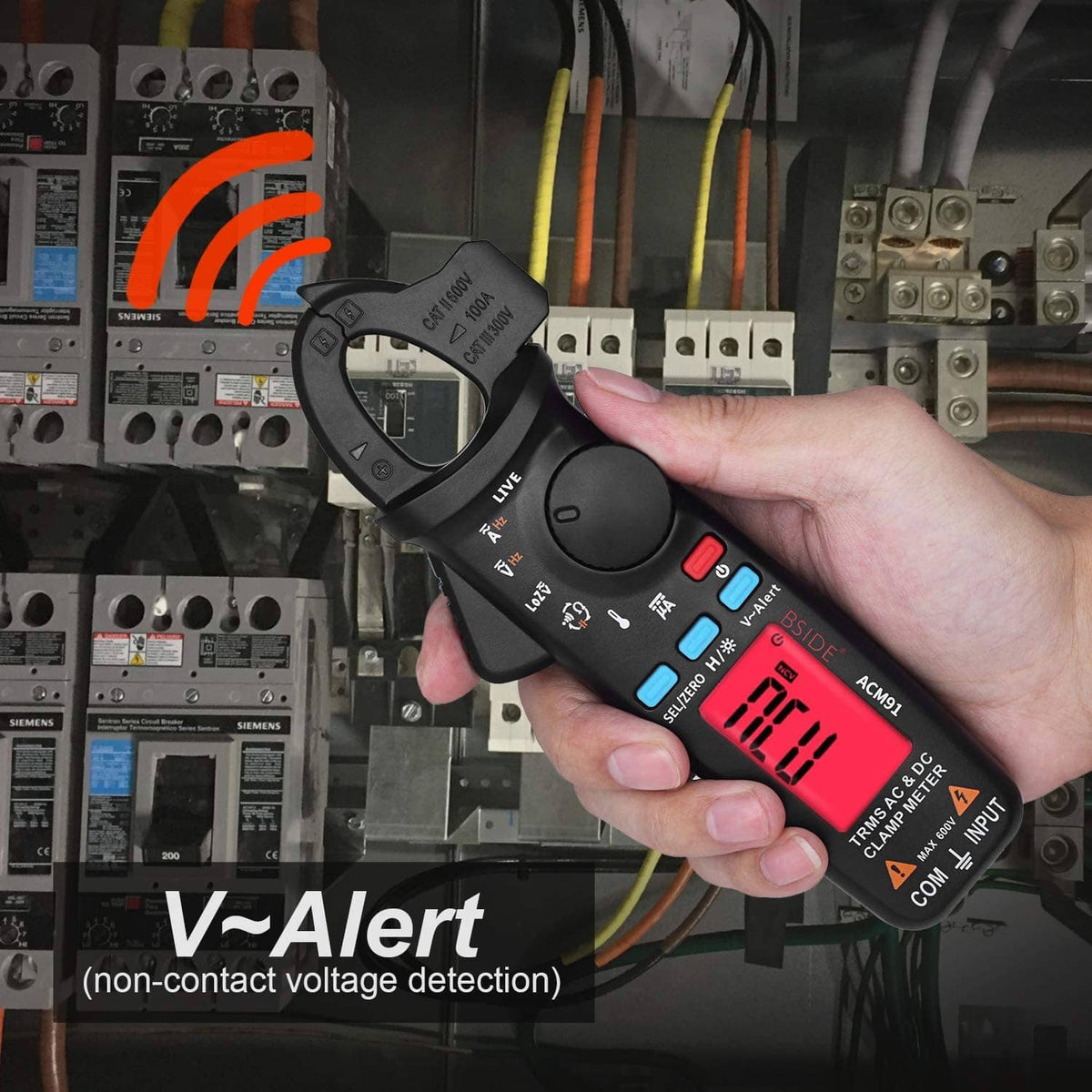 Digital clamp meter in hand with red alert display and open jaw for voltage checking