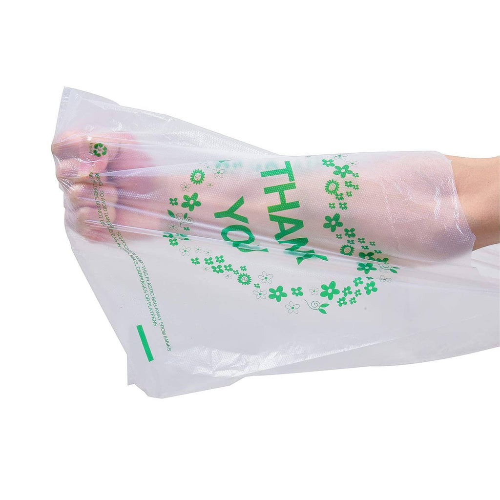 White plastic bag with handles, green THANK YOU text and clover wreath design