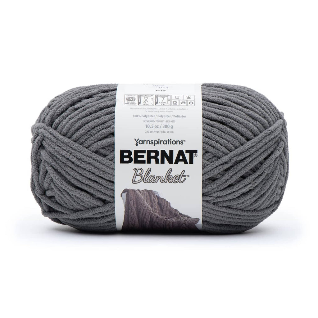 Super bulky acrylic blanket yarn skein, dark gray; label and thick ribbed texture