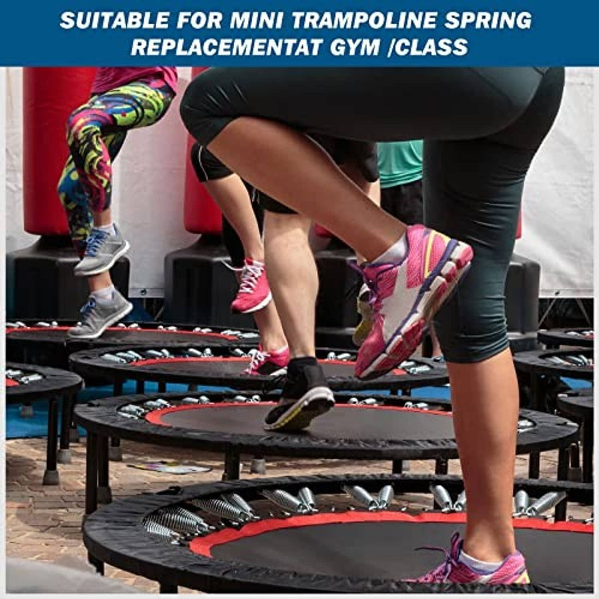 Mini trampoline with silver replacement springs and curved hook ends visible