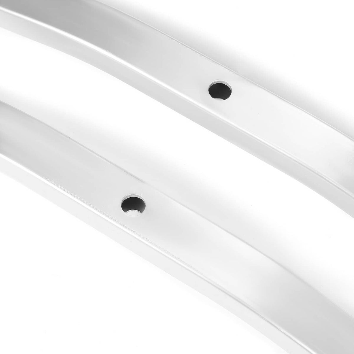 Silver ski tie-down bar detail with circular mounting holes along the center