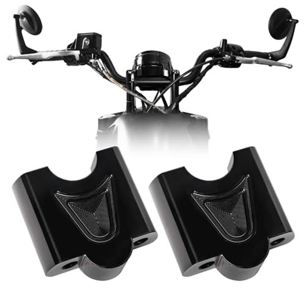 Black handlebar riser clamp blocks with mounting bolts, installed on motorcycle handlebars