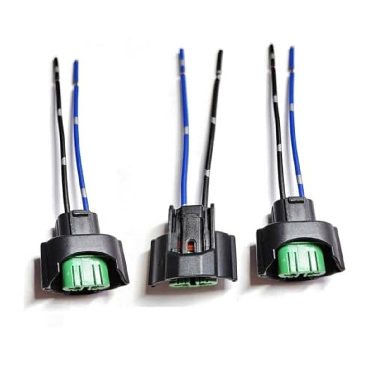Three headlight bulb adapter plugs with green sockets, black housings, blue/black wiring
