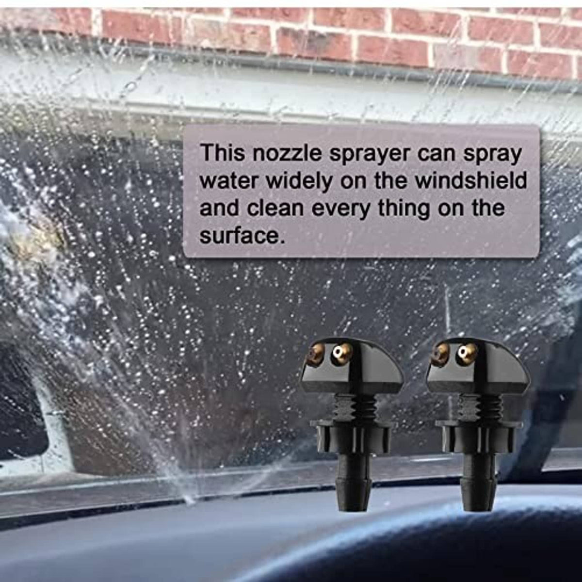 Two windshield washer nozzles spraying water mist, black plastic with brass ports