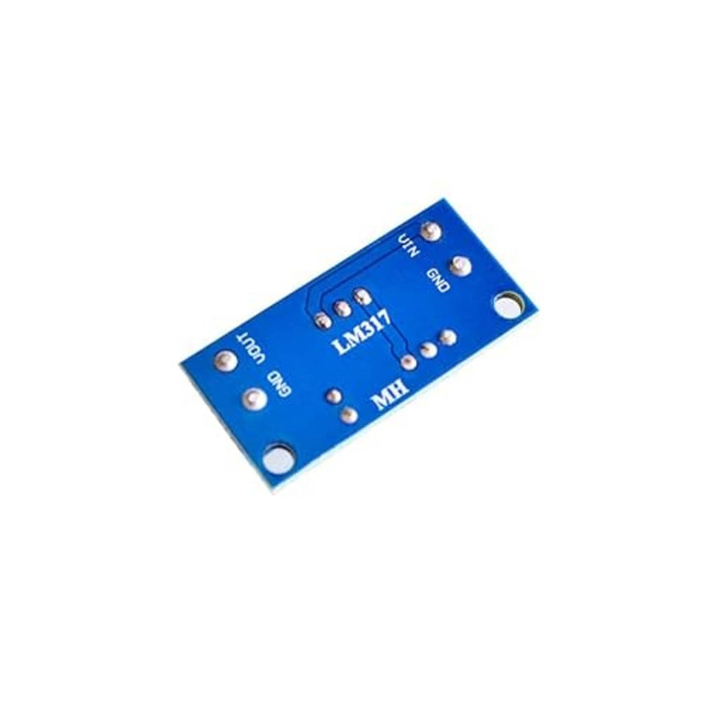 LM317 module breakout board with blue PCB and printed input/output labels