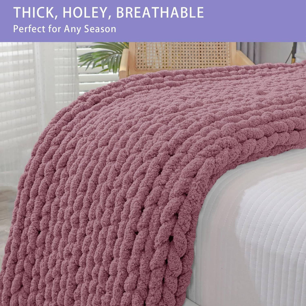 Thick chunky knit throw blanket in burnt rose, close-up of looped pattern on roll