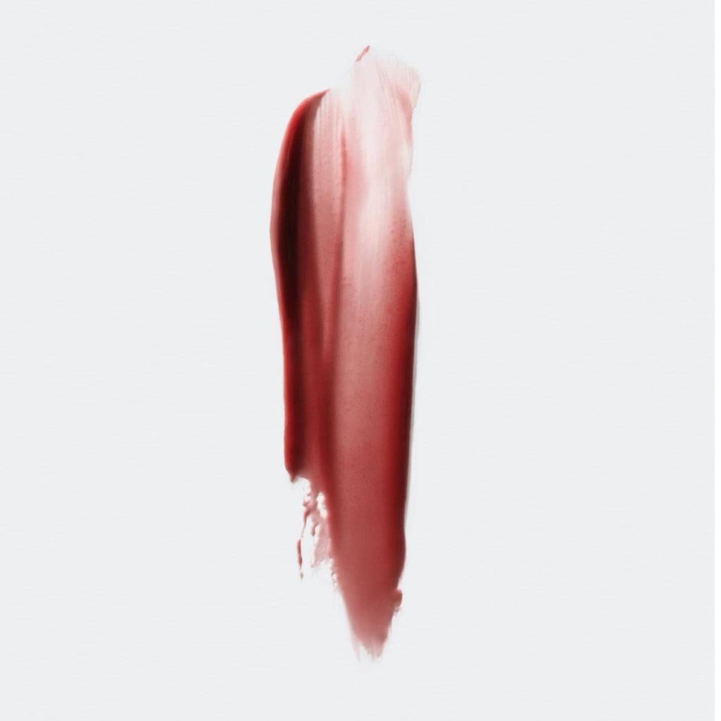 Dark rose-brown lip gloss swatch with glossy, plush shine smear