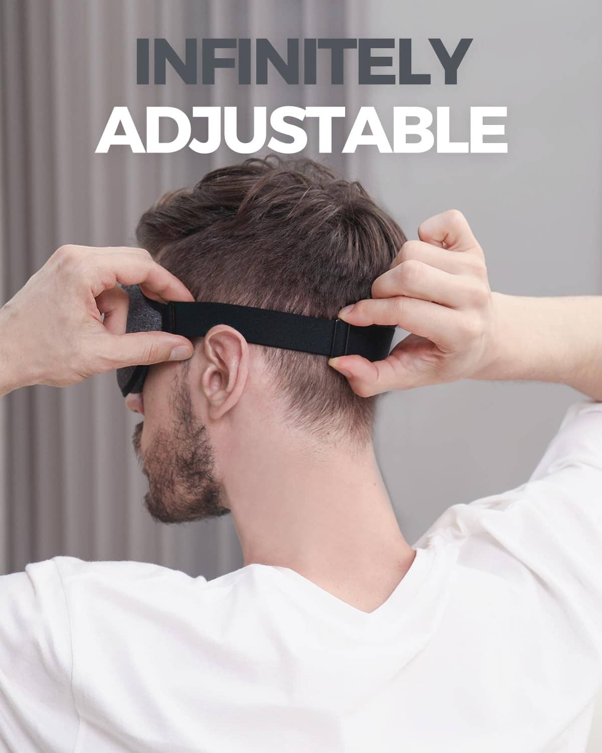 Adjustable dark gray sleep mask with black edge and strap, contoured eye cover