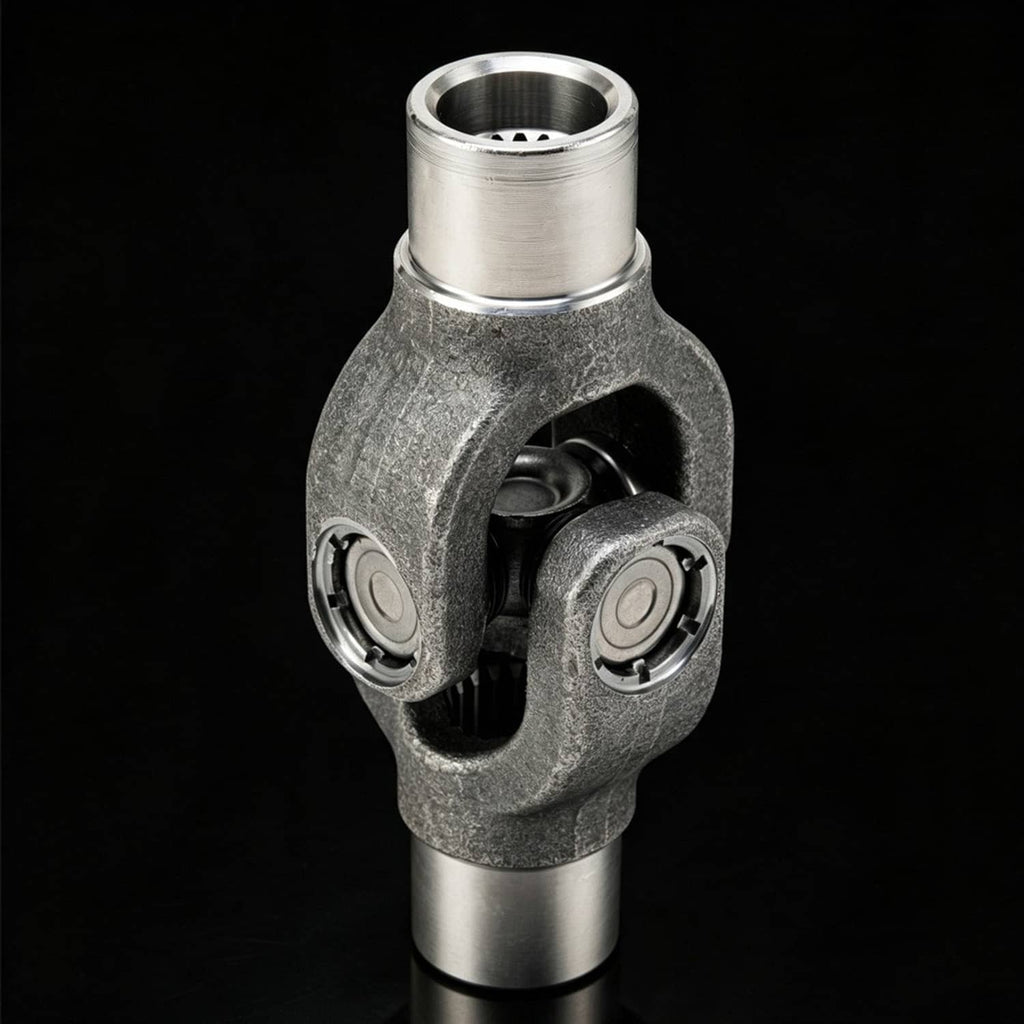 Gray drive shaft yoke U-joint with two silver shafts and exposed joint caps