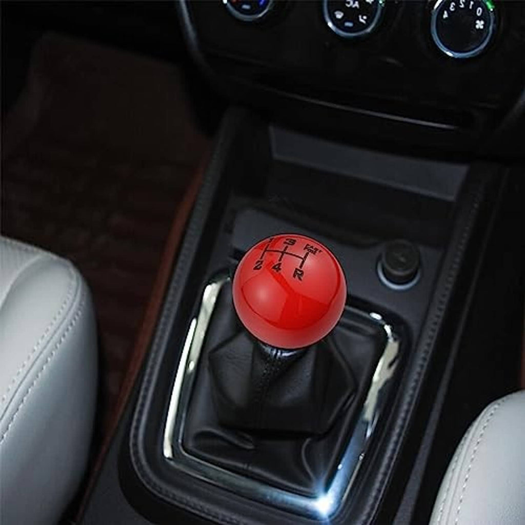 Red 5-speed gear shift knob installed on car shifter with black leather boot