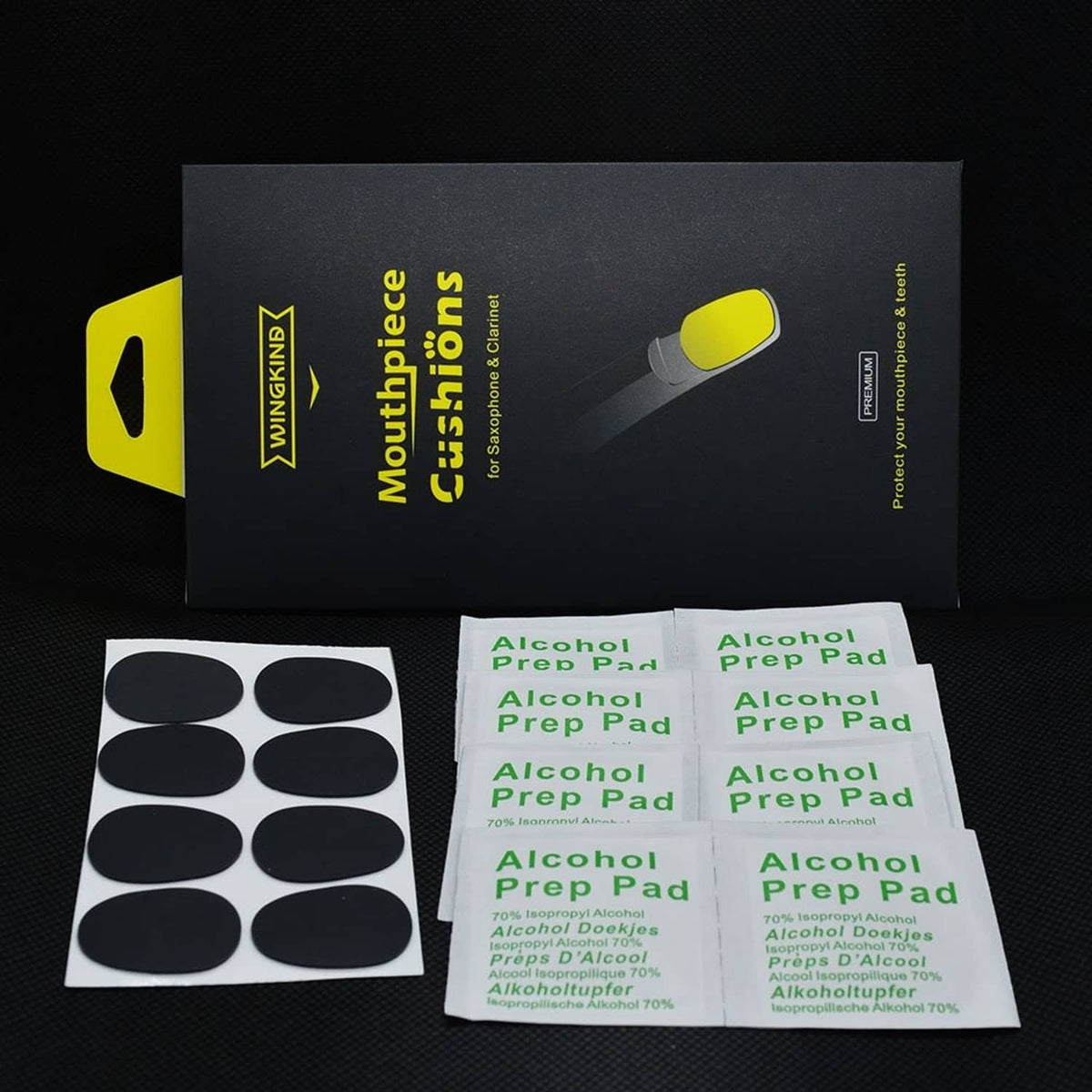 Mouthpiece cushion and alcohol prep pad package with black adhesive cushion circles