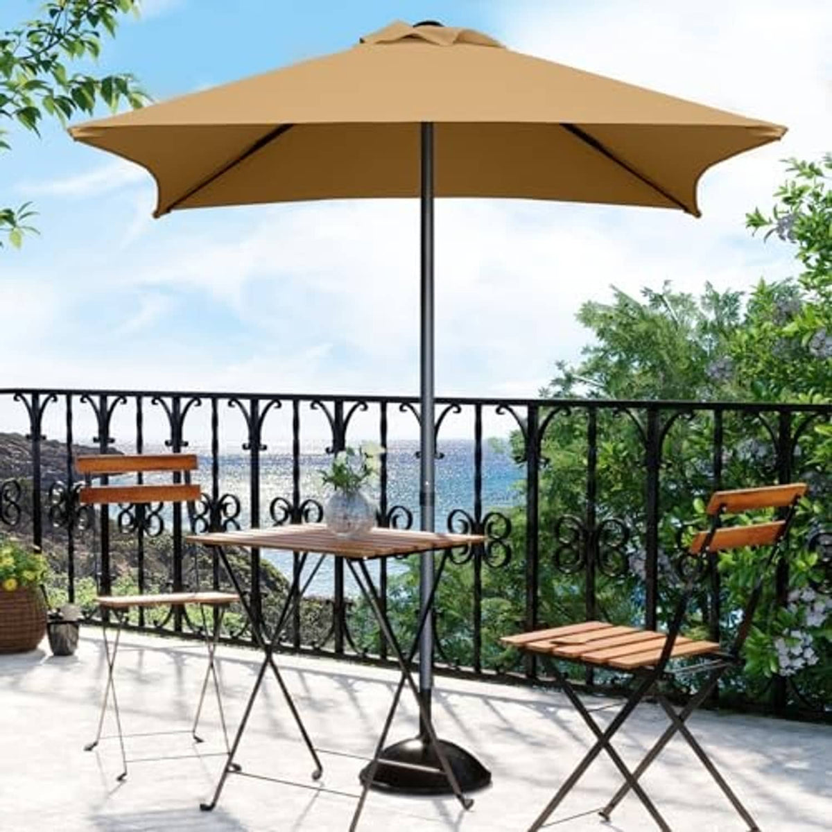 Tan mini square patio umbrella with black pole and open canopy