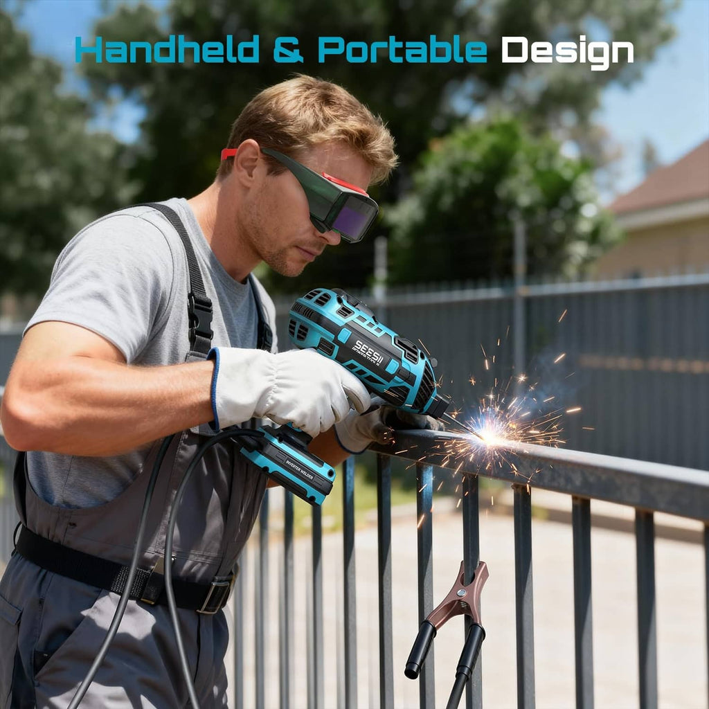 Handheld blue SEESII welder in use with gloves and auto-darkening welding visor