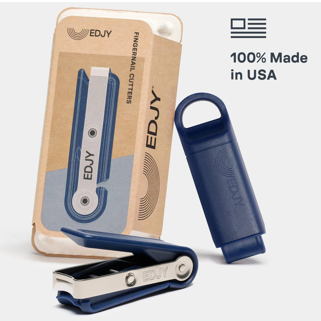 Navy stainless steel fingernail cutter with protective cap and retail package