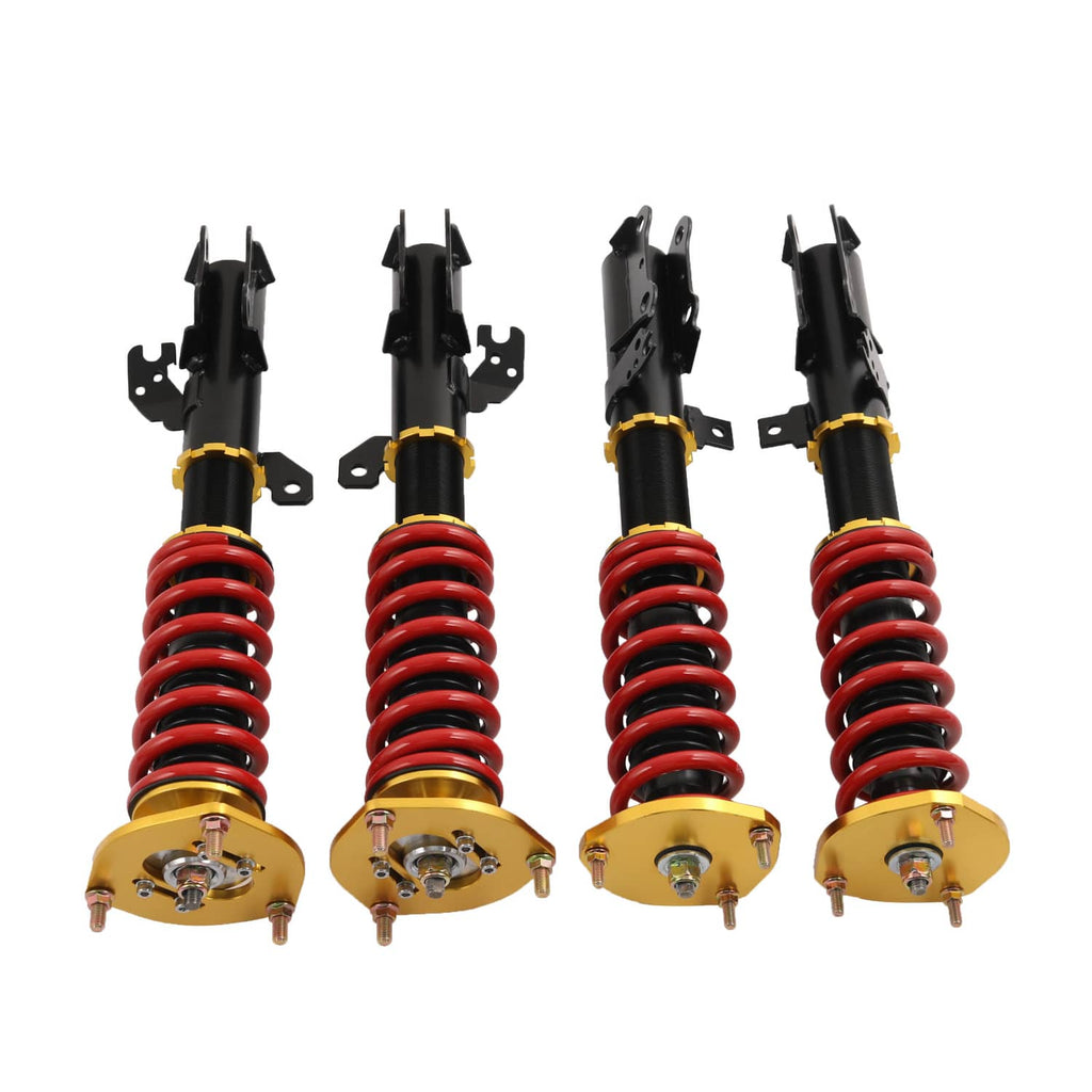 Adjustable coilover strut set with gold bases, black shocks, and red spring coils