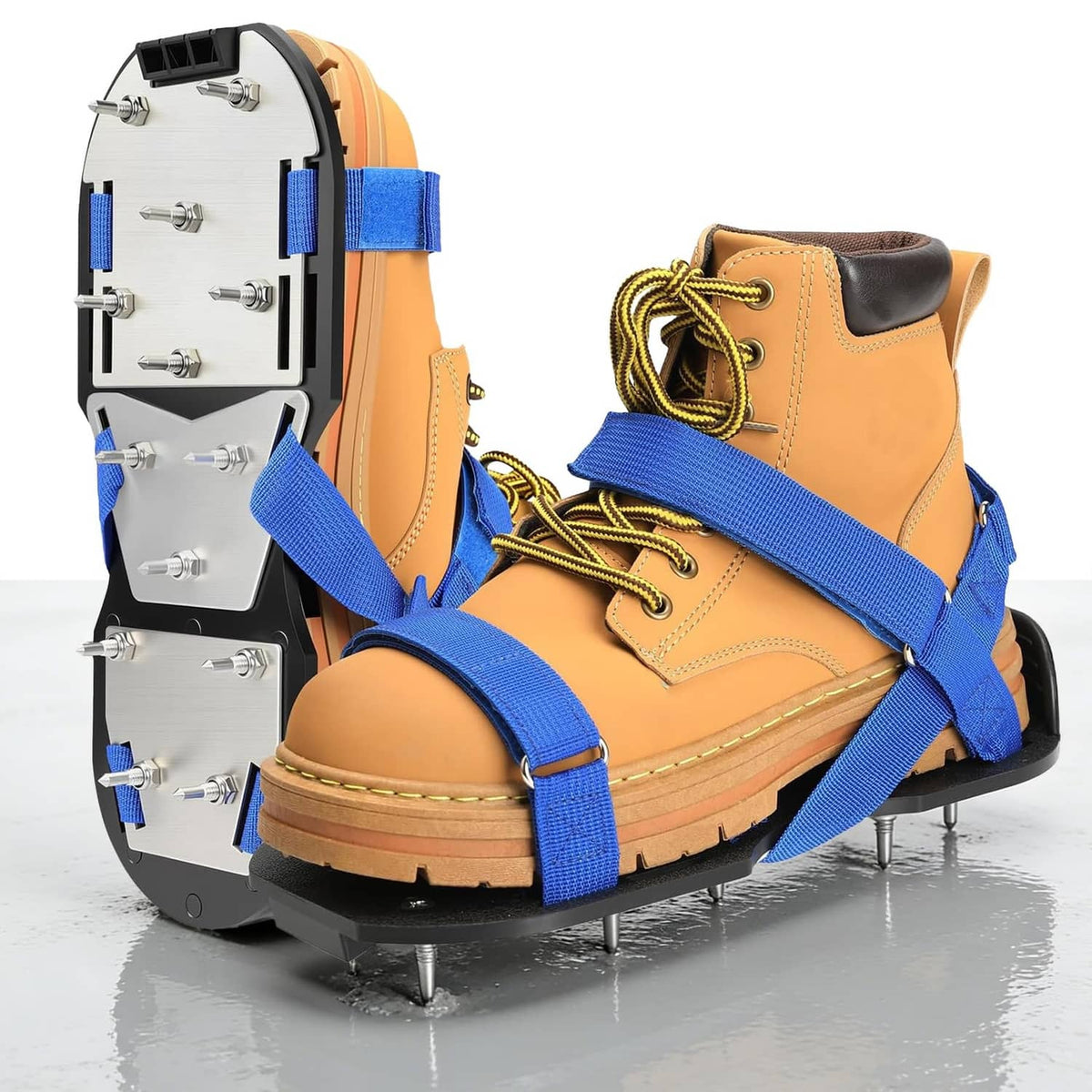 Tan spiked work shoes with blue crisscross straps and lace-up front