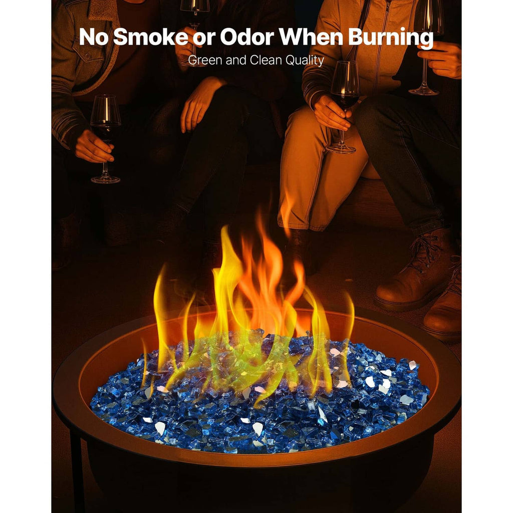 Pacific blue crushed glass rocks in an outdoor fire pit, flames burning above.