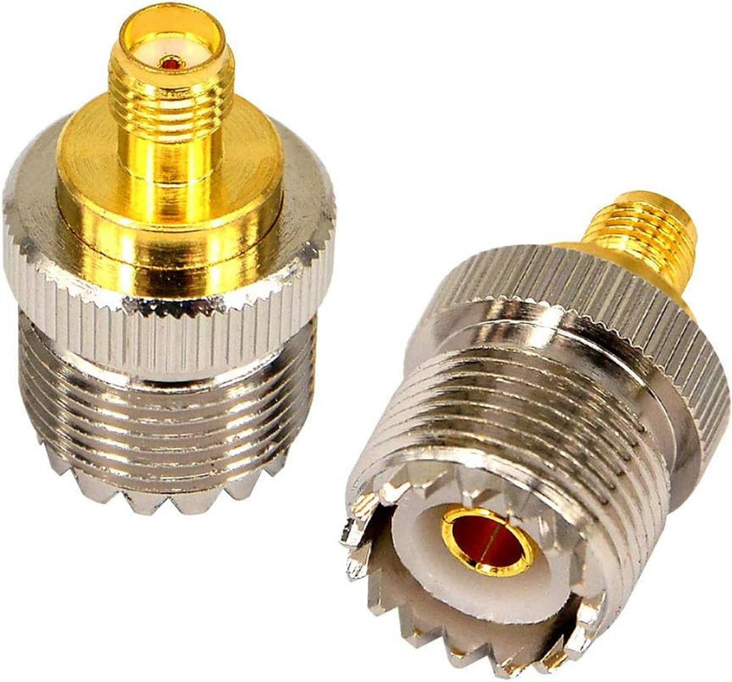 Pair of coax adapters with gold contacts and silver ribbed threads