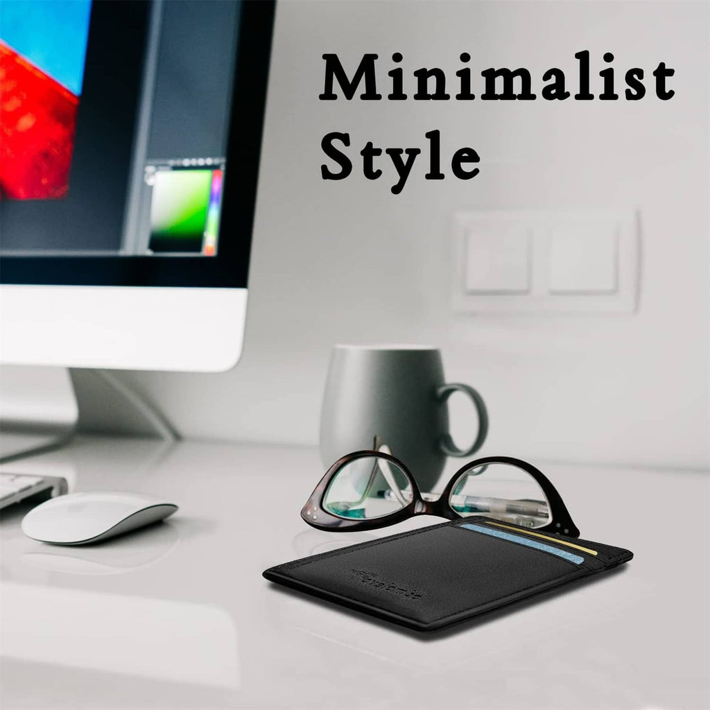 Black slim leather wallet with front card slots, shown on a desk