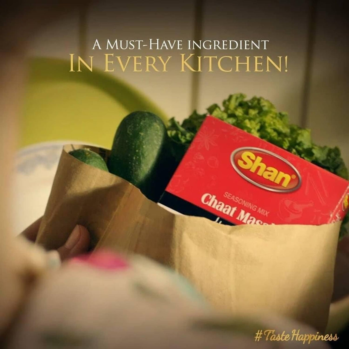 Shan Chaat Masala seasoning mix packet in a paper bag with vegetables promotional