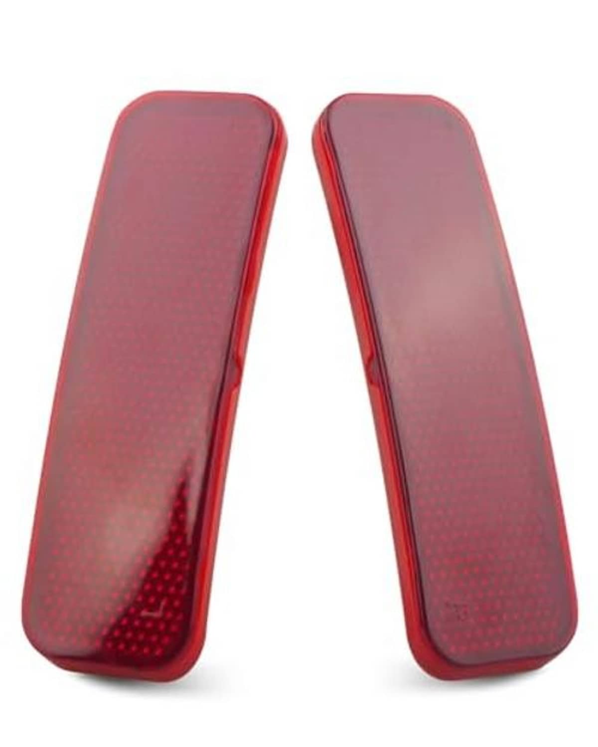 Two red rear bumper reflector tail lights with textured lens and red border