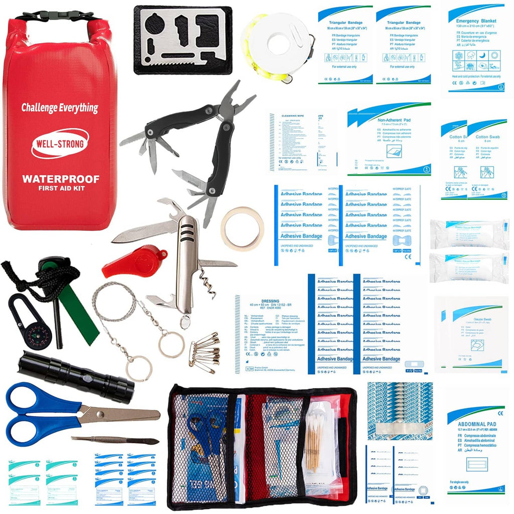 Red waterproof first aid kit roll-top with tools, bandages, and instruction cards