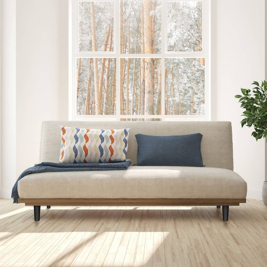 Black plastic furniture legs under a beige sofa