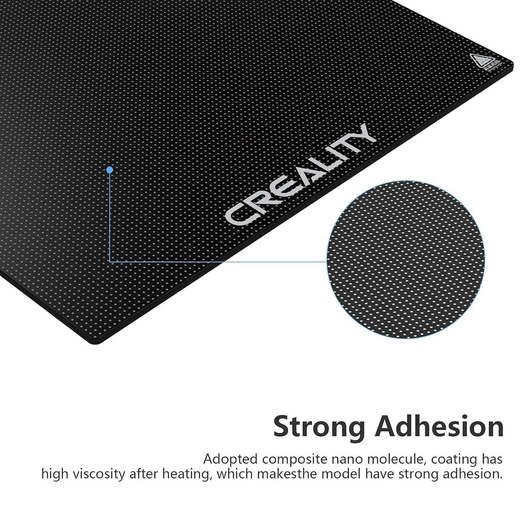 Creality 3D printer glass bed platform, dark dotted surface close-up