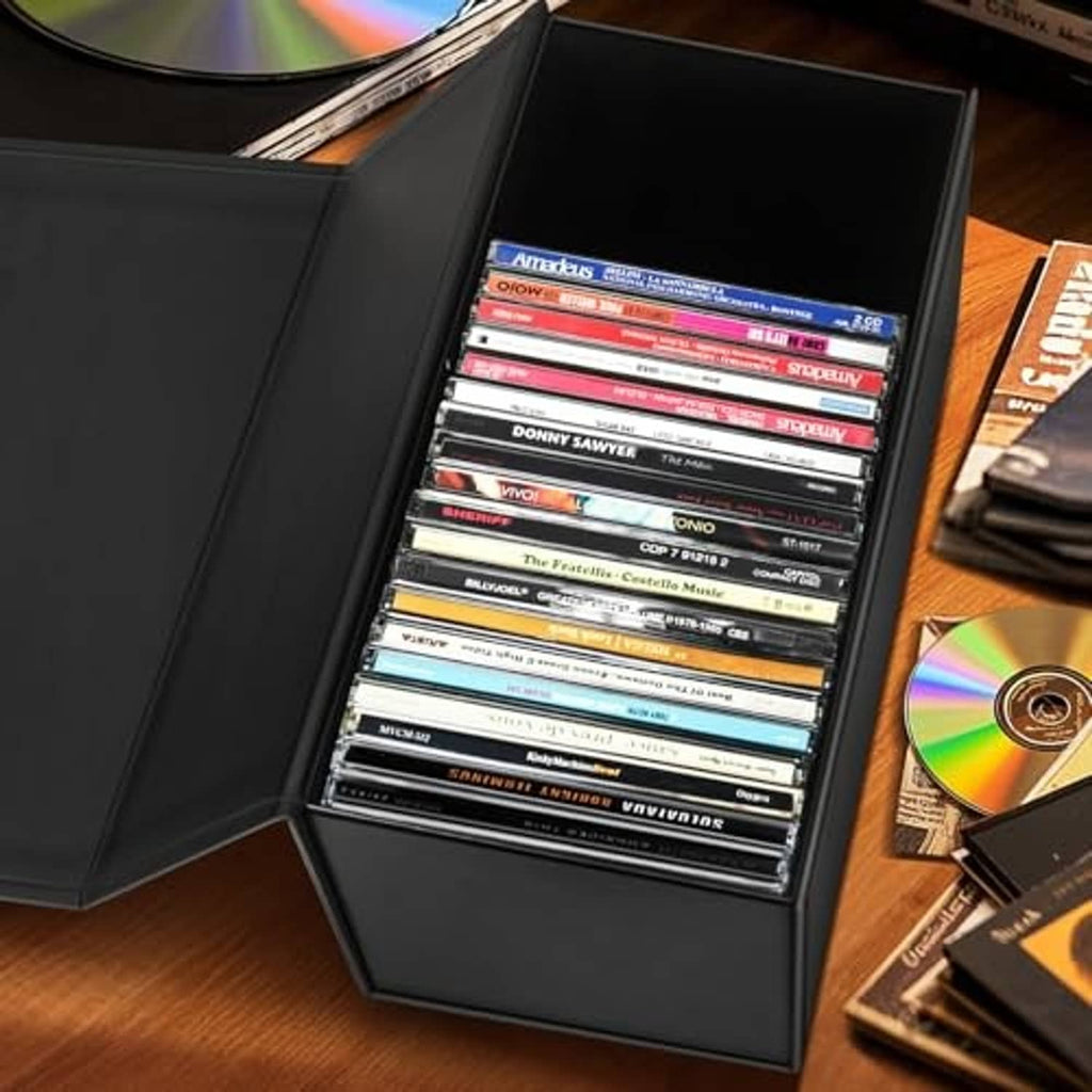 Black CD storage box open, multiple jewel cases visible in the storage tray