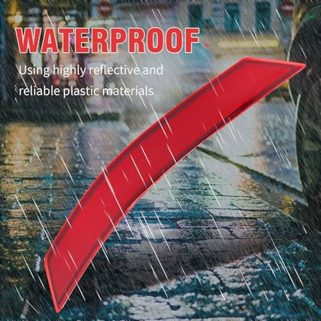 Red rear bumper reflector with textured lens surface for visibility